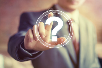 Businessman touch button web question sign
