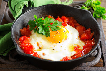 Scrambled eggs with roasted tomatoes.
