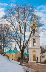 Fototapeta na wymiar Bell tower of an ancient cloister in Dmitrov near Moscow