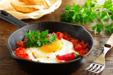 Scrambled eggs with roasted tomatoes.