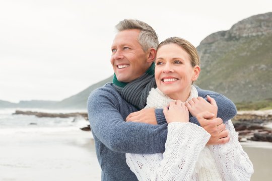 Cute couple standing and holding each other