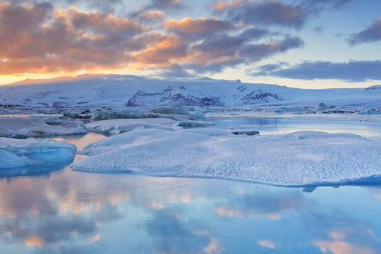 Icebergs in Jökulsárlón glacier lake at sunset