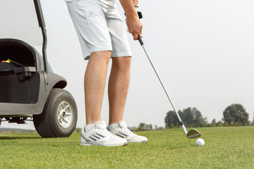 Young golfer getting ready to hit the ball