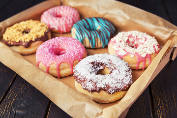 Fresh homemade donuts with various toppings - 91122855