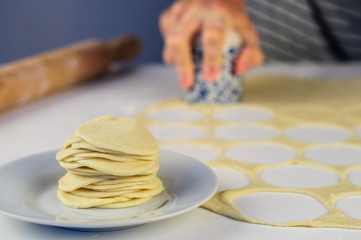 Fototapeta na wymiar Man hands making dumplings with meat