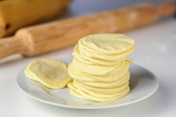 Man hands making dumplings with meat