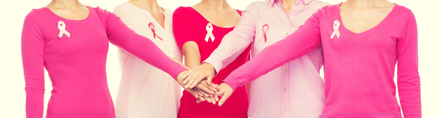 close up of women with cancer awareness ribbons