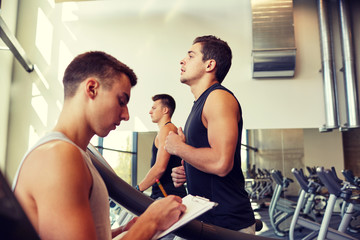 men exercising on treadmill in gym