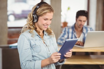 Woman holding digital tablet 