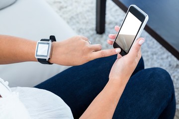 High angle view of woman scrolling on mobile phone