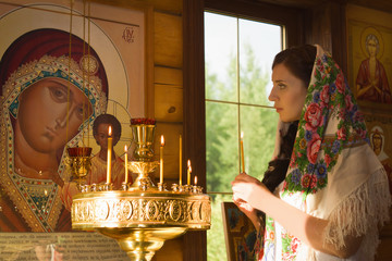 Russian woman praying in church