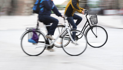 Fototapeta na wymiar Two young men on bicycles
