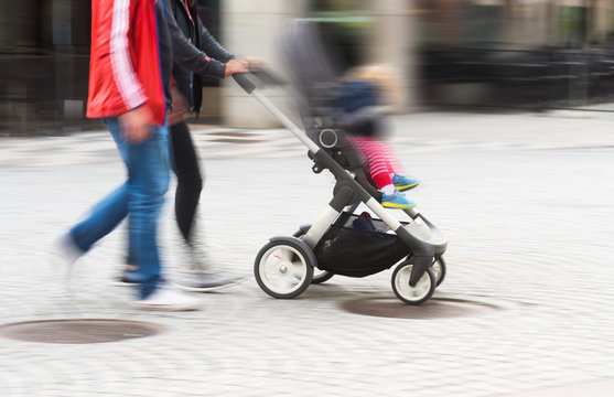 Young parents with pram