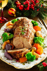 Roast pork with vegetables and spices.