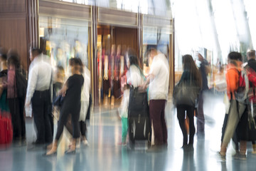 Abstract crowd, traveler silhouettes in motion blur, airport int