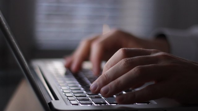 late working hours, hands of business man typing on laptop in his office