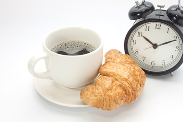 Coffee cup with a croissant isolated
