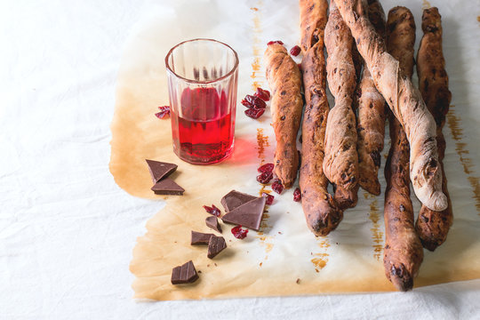 Grissini bread and red liqueur
