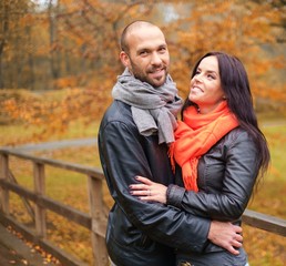 Fototapeta premium Happy middle-aged couple outdoors on beautiful autumn day
