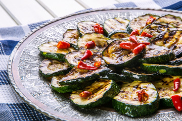 Zucchini.  Grilled zucchini. Slices of grilled zucchini on a plate. Vegetarian - Mediterranean cuisine. 