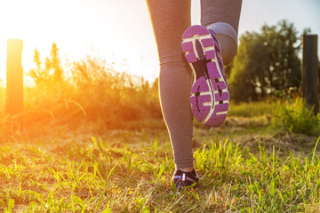Woman running in a field