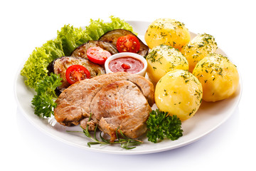 Fried steak, boiled potatoes and vegetable salad 