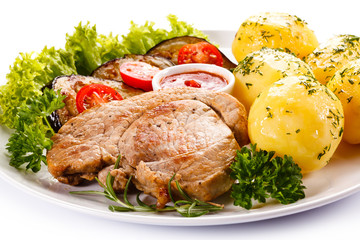 Fried steak, boiled potatoes and vegetable salad 