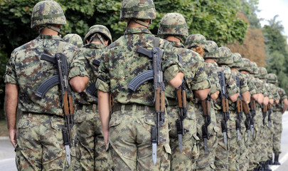Soldiers marching with rifles
