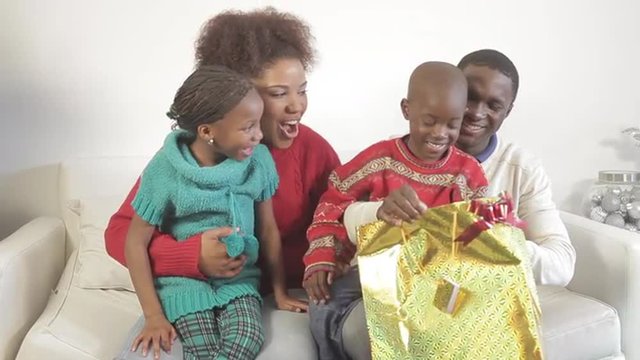 Black family opening theirs christmas gifts