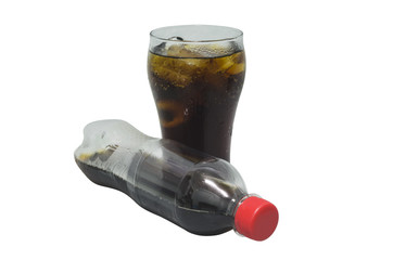 Soft drink in glass and bottle on white background