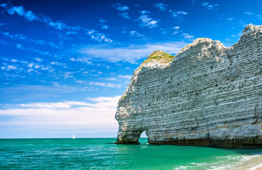 Naklejka premium Famous natural cliffs in Etretat. Etretat is a commune in Seine-