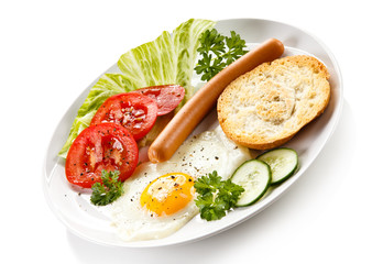 Fototapeta na wymiar Breakfast - fried egg and sausage