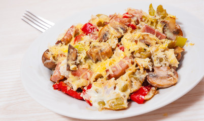 fried eggs with pepper, mushrooms, ham and cheese
