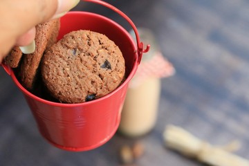 Tasty chocolate chip cookie and sour milk