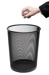 Hand Holding Paper over Trash Bin with Clipping Path