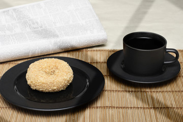 Donut and Coffee or Tea with Newspaper