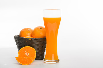Orange juice in glass and slices orange