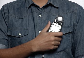 photographer holding a light meter