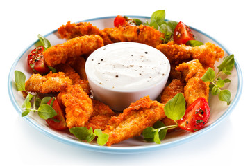 Fried chicken nuggets and vegetables