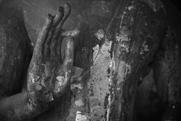 Hand of old Buddha statue