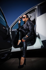 Young woman in leather clotes