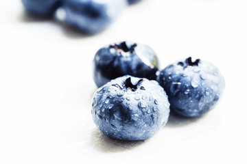 Fresh ripe blueberries on white background, selective focus