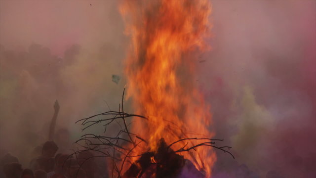 flames shooting into the air from a pyre at a Hindu festival