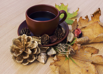Aromatic fresh coffee on the table with autumn decorations