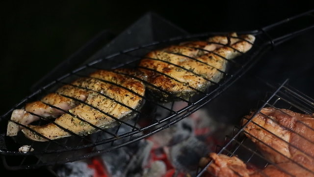 Meat on the grill with flames closeup