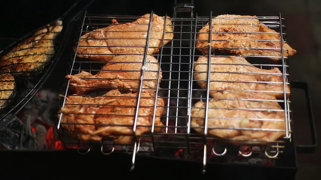 Meat on the grill with flames closeup