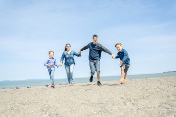 Portrait of a Family having fun at the beach