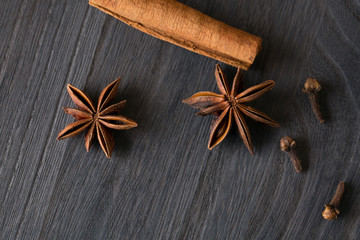 cinnamon and anise on the wooden background