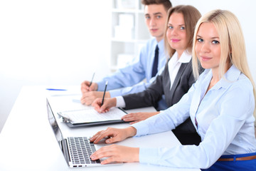 Obraz premium Business people discussing the ideas at meeting , focus on blond woman