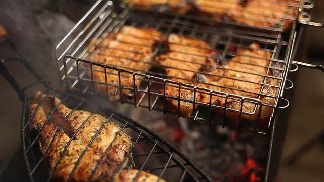 Meat on the grill with flames closeup